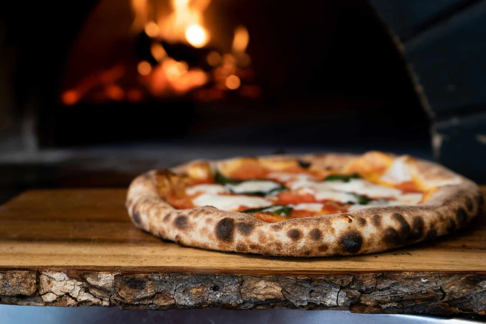 pizza infront of an overn